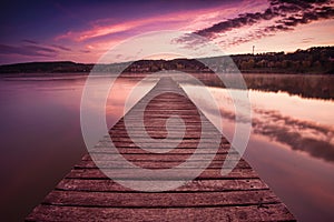 An empty pier, a beautiful lake