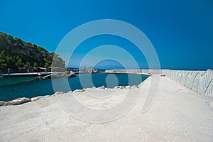 Empty pier, concrete pier, the water is surrounded by the structure, outdoor pool