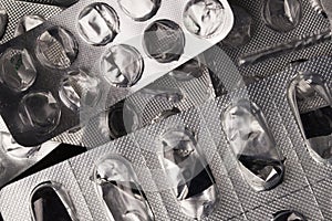 Empty pill blister background,  tablet blisters silver texture pattern close-up. Empty blisters of pills. Drug, care