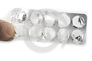 Empty pillblister in hand on a white