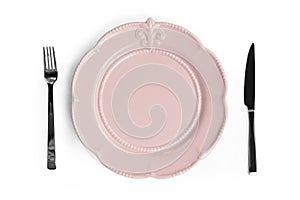 Empty pink plate with a knife and fork