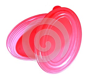 An empty pink snack plastic box with cap.