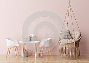 Empty pink wall in modern child room. Mock up interior in scandinavian, boho style. Free, copy space for your picture