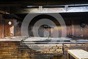 Empty pit room of old Texas BBQ Meat Market in West Texas, Ameri