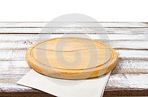 Empty pizza board and tablecloth on table isolated on white background copy space