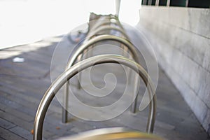 Empty place for a parking of bicycles under the apartment in metal rack