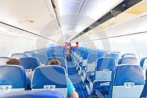 Empty plane interior with few people