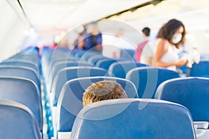 Empty plane interior with few people