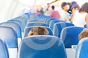 Empty plane interior with few people