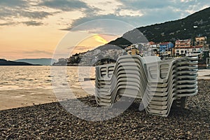 Empty plastic beach lounge chairs