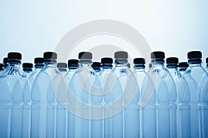 Empty plastic bottle silhouettes on blue background
