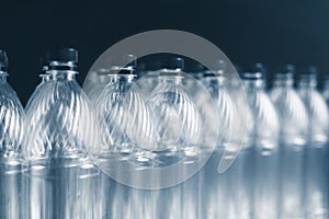 Empty plastic bottles on dark background