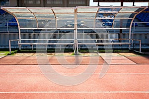 Empty plastic chairs for sports staff at the grandstand stadium