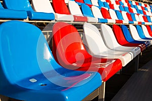 Empty Plastic Chairs In Stadium.