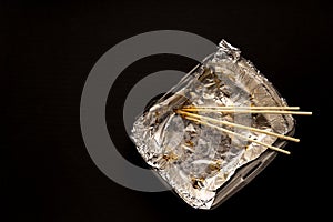 An empty plastic container for the delivery of a set of sushi