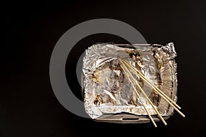 An empty plastic container for the delivery of a set of sushi