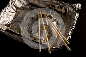 An empty plastic container for the delivery of a set of sushi