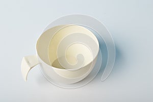An empty plastic cup isolated on a white background