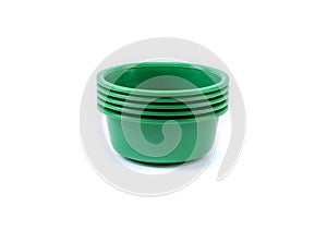 Empty plastic deep plates of different colors on a white background. Several plates.