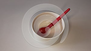 Empty plastic dinnerware on white table background