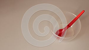 Empty plastic dinnerware on white table background