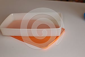 Empty plastic dinnerware on white table background