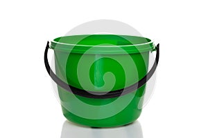 empty plastic green bucket with black handle on white isolated background