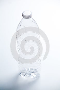 Empty Plastic Water Bottle on a White Background