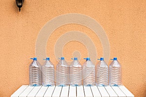 Empty plastic water bottles on table