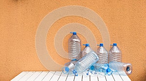 Empty plastic water bottles on table