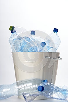 Empty plastic water bottles thrown into the trash