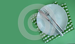 Empty Plate, Fork, Knife on a Colored Backgroundbreakfast photo