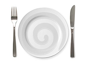 Empty plate with knife and fork on a white background.