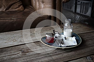 Empty plate with lefts overs of food on places on a rustic table