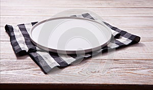 Empty plate and napkin on white wooden table. Empty tray mock up for design. Top view.