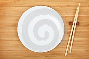 Empty plate and sushi chopsticks