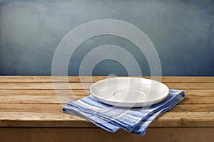 Empty plate on tablecloth