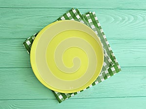 Empty plate of a towel on a minty wooden background