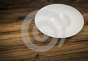 Empty Plate on White Wooden Table with Copy Space