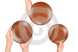 Empty plate in woman hands isolated on white background