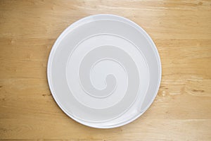 Empty plate on wooden tabel photo