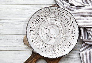 Empty plate on a wooden table