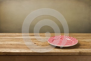 Empty plate on wooden table