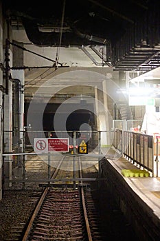 Empty platform in old Hung Hom station in Hong Kong at night