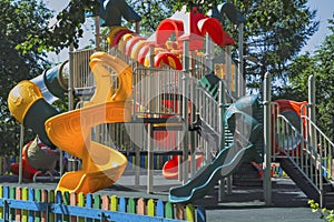 Empty playground in a city park on a hot sunny summer day.