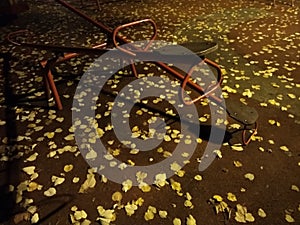 An empty playground with metal teeter at night and creepy atmosphere