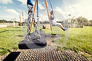 Empty playground swing photo