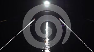 Empty pool with lunar path water and dividers track for swimming. Blue water in swimming pool. Night shot.