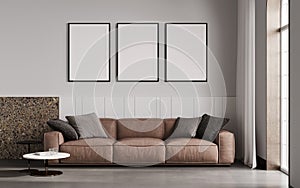 Empty poster frames on gray concrete wall in living room interior with modern furniture and big arch window, brown sofa, loft, 3d