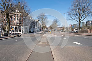 Empty Prins Hendrikkade in the center of Amsterdam during the Corona crisis photo